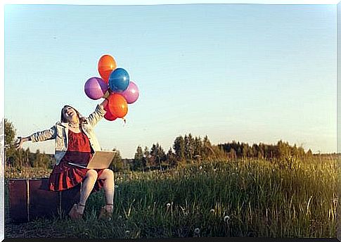 Happy girl with balloons