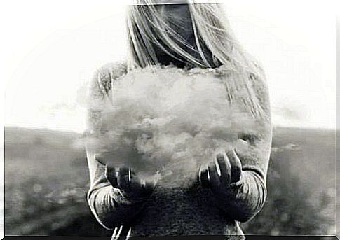 Woman holding a cloud in her hand