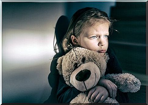 Little girl with soft toy