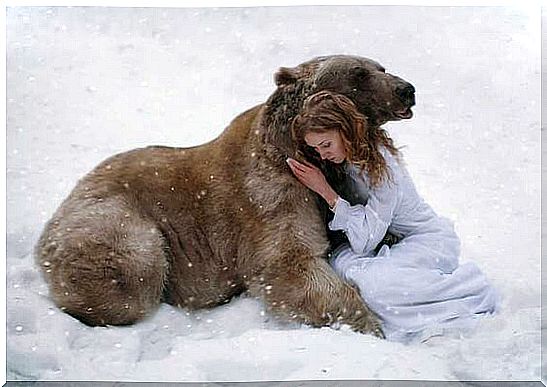 girl hugging a bear