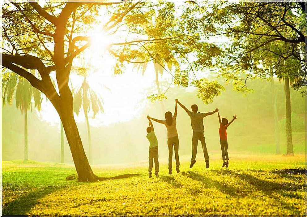 Happy family under a tree