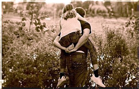 Father and daughter riding a horse.