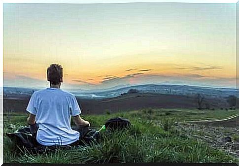 Man meditates outdoors